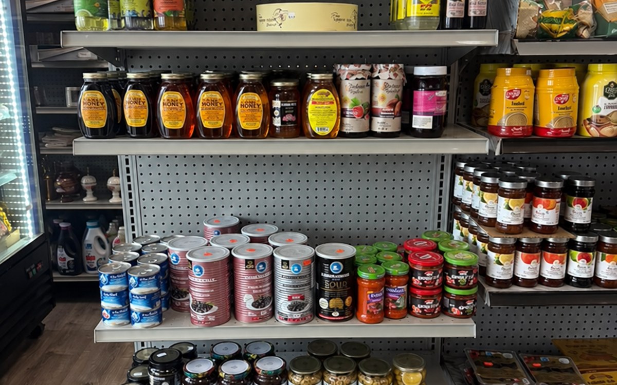 Market shelves showing Mediterranean drinks and pantry foods