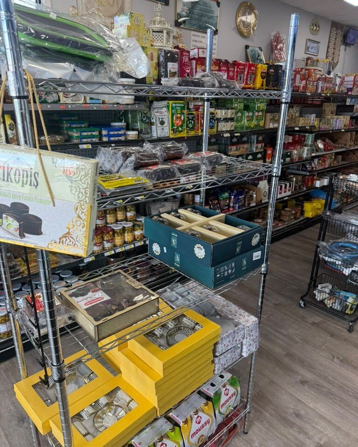 Tea sets and decorative goods on shelves inside Turkish Market